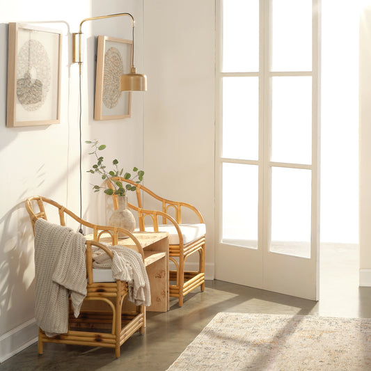 Jeno Swing Arm Wall Sconce by Jamie Young in satin brass. Made from metal in a modern style.