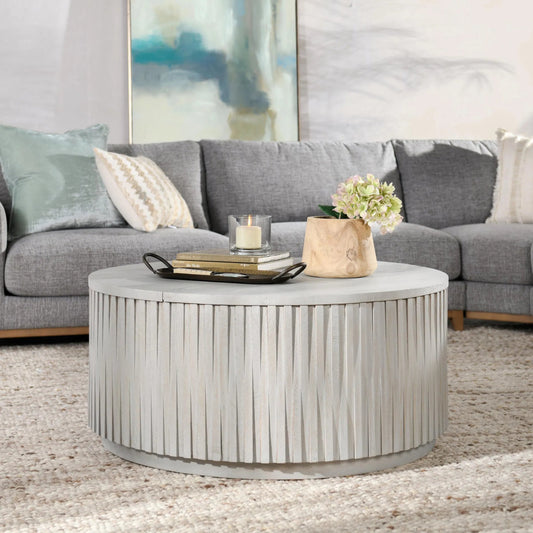 Mrytle Round Coffee Table by Classic Home in distressed light gray. Made from mango wood in a modern style.