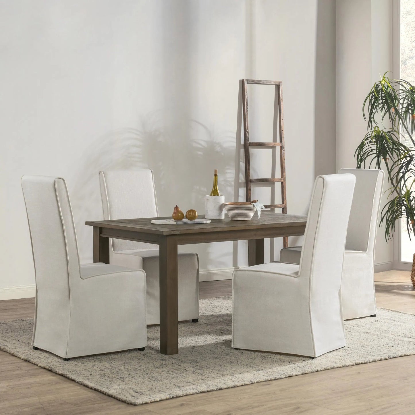 006 SR-897691 | Lifestyle | Driftwood Dining Table by Kosas Home in desert gray. Made from reclaimed pine wood in a rustic style.