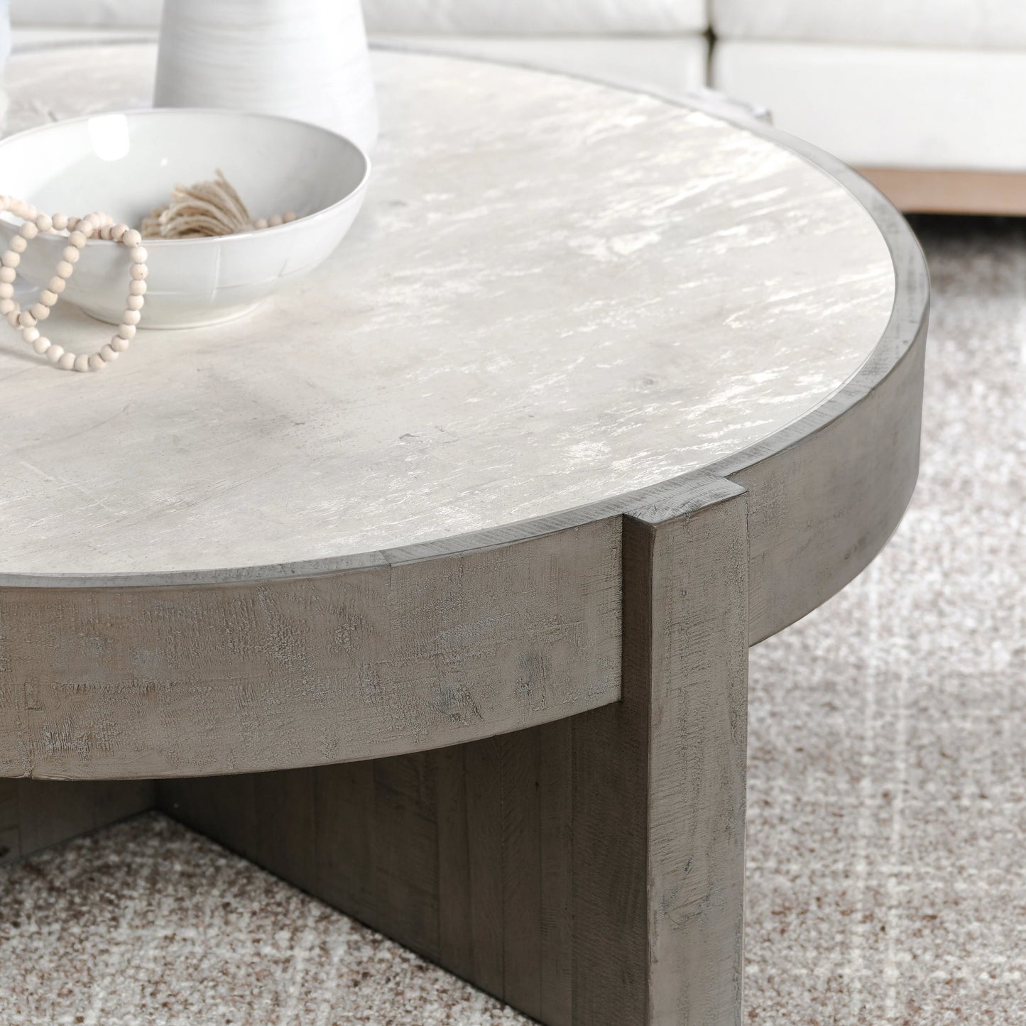 007 SI-2160261 | Lifestyle | Sonoma Round Reclaimed Pine Coffee Table by Classic Home in corsican grey & antique white top. Made from reclaimed pine, concrete laminate top in a modern style.
