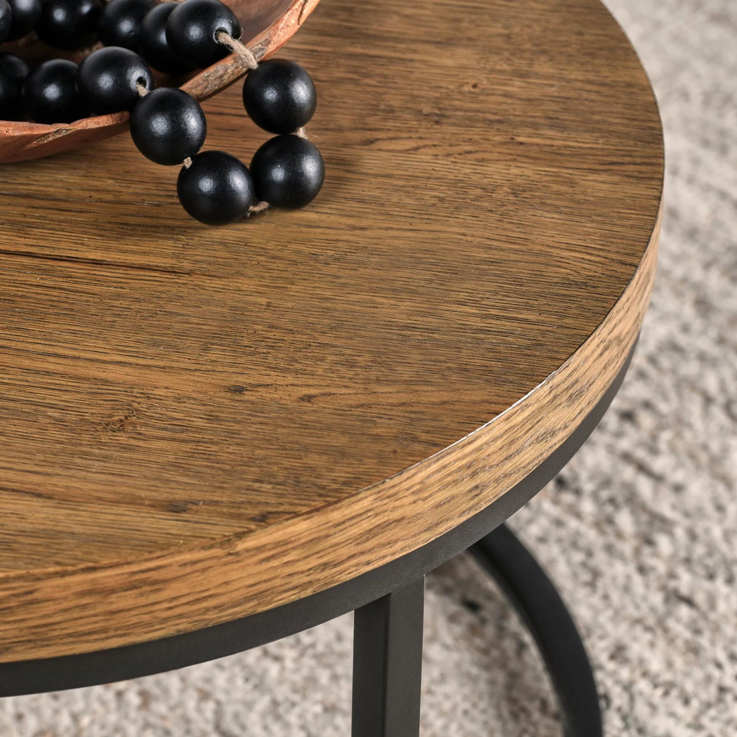 004 SI-2249237 | Closeup | Catta Round Wood Coffee Table by Kosas Home in light brown, black. Made from oak veneer, iron in a unique style.
