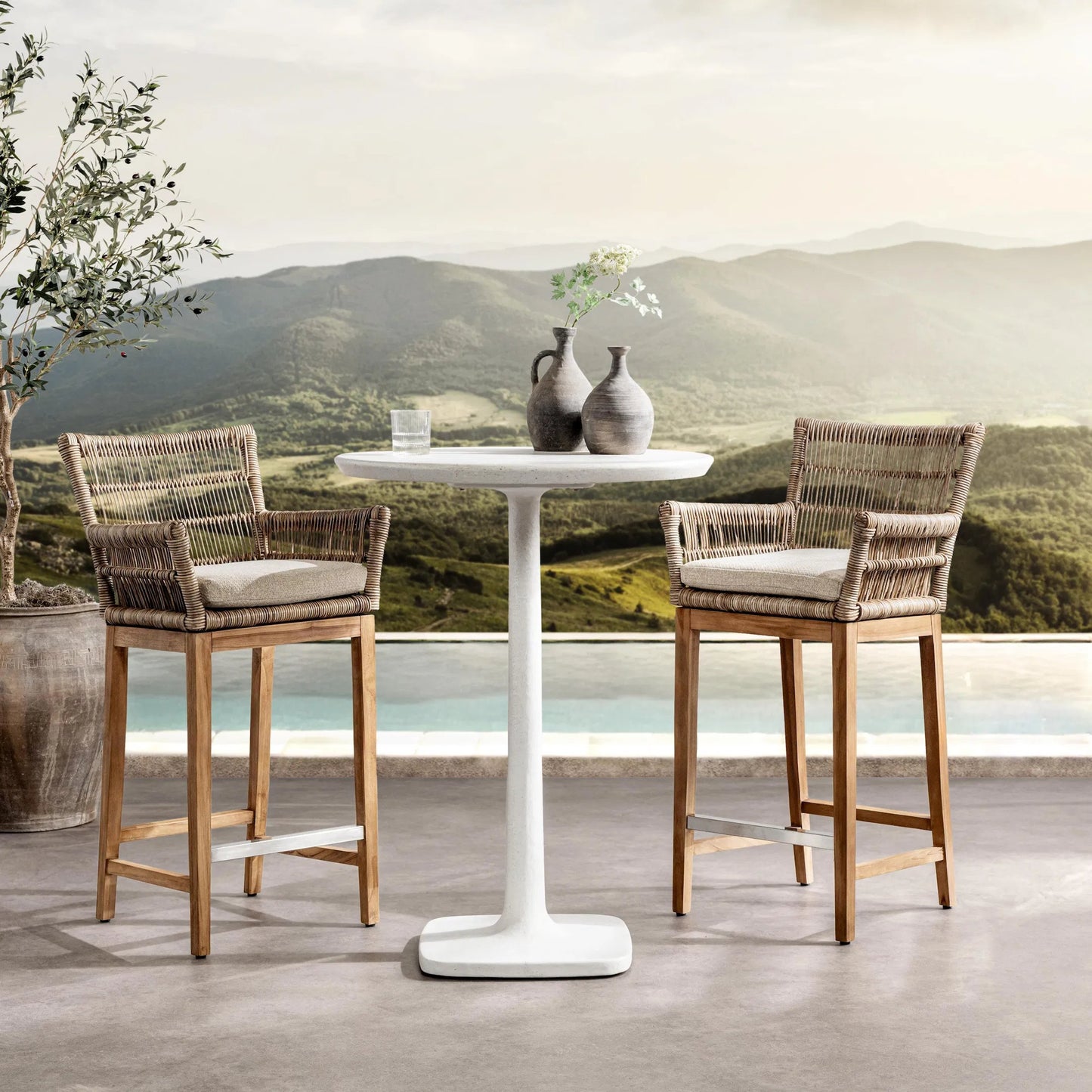 005 SI-2537795 | Lifestyle | Paulina Outdoor Bar Table by Classic Home in white. Made from glass fiber reinforced concrete in a unique style.