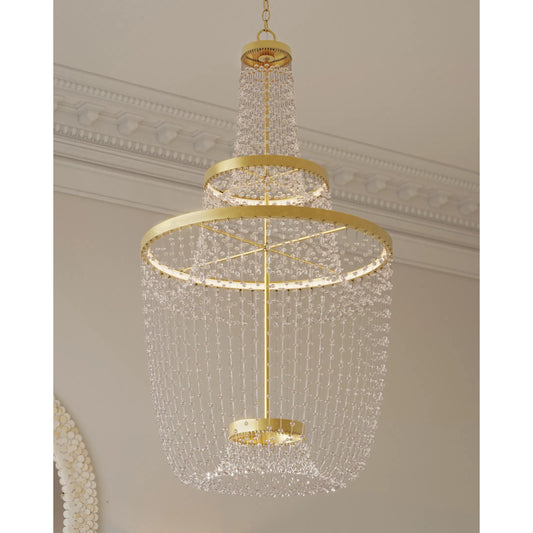 Mademoiselle Chandelier by Currey and Company in contemporary gold leaf, contemporary gold, clear. Made from glass beads, wrought iron in a modern style.