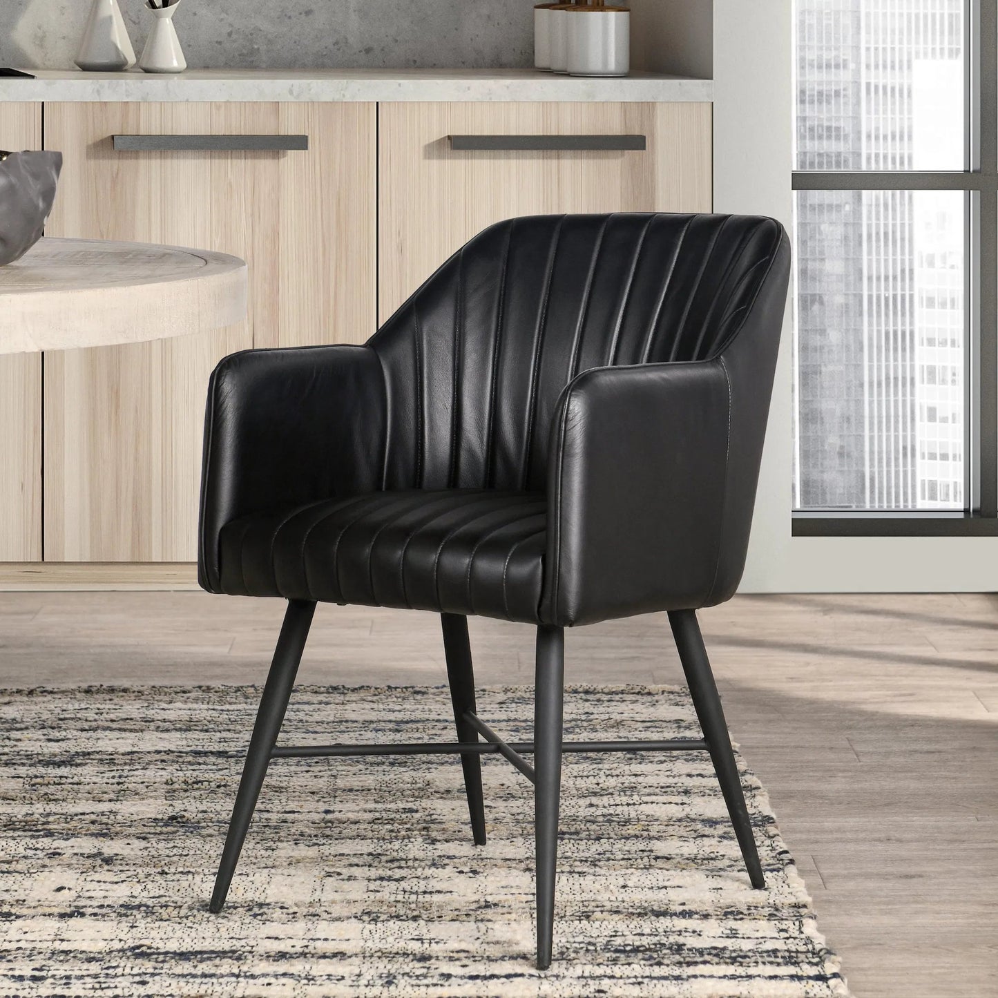 010 SI-2256332 | Lifestyle | Leon Leather Dining Chair by Classic Home in jet black. Made from top grain buffalo leather in a modern style.