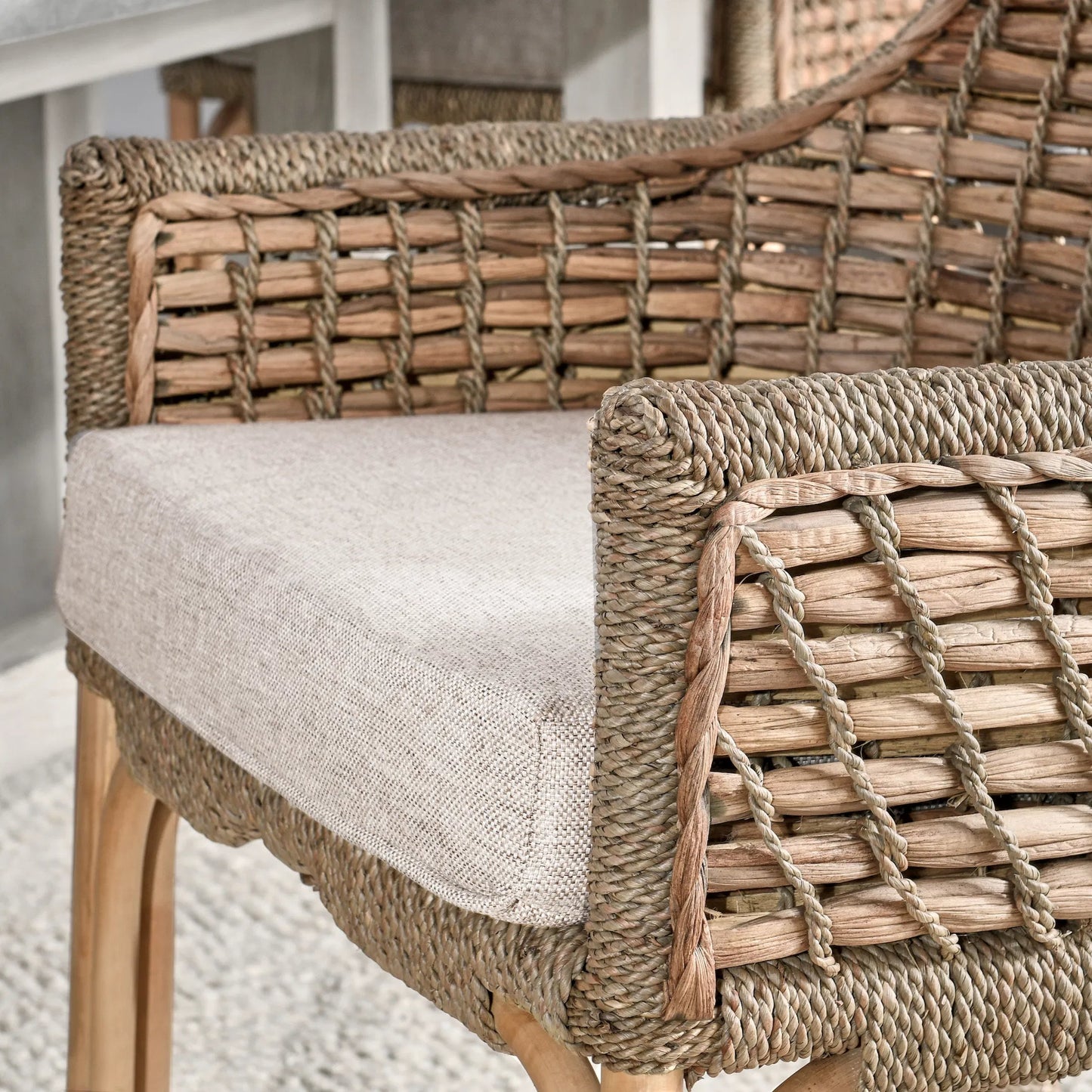 007 SI-2007520 | Closeup | Nuevo Arm Chair by Kosas Home in wood. Made from rattanpole semipolished, 100% polyester in a cottage & farmhouse style.