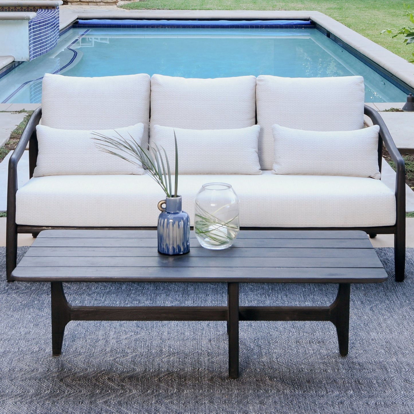 004 SI-2078805 | Lifestyle | Aria Outdoor Sofa by Classic Home in cream, black. Made from teak wood, wicker, 100% olefin in a modern style.