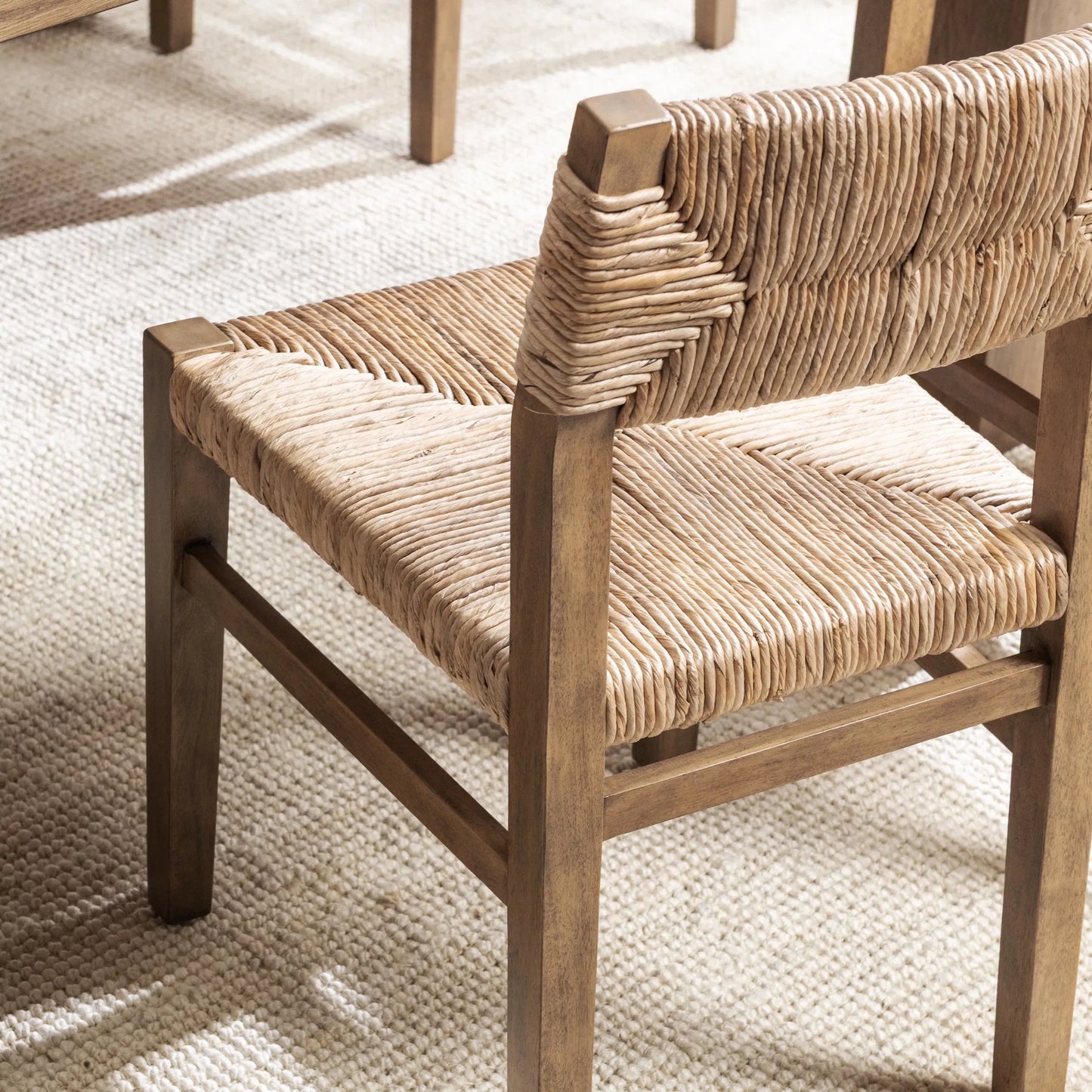 009 SI-2518865 | Lifestyle | Meryn Dining Chair (Set of 2) by Kosas Home in brown wash. Made from banana bark, mahogany wood in a transitional style.