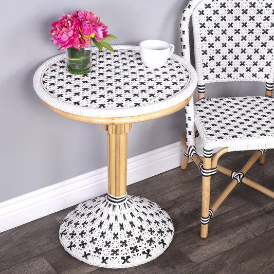 Tenor Bistro Table by Butler Specialty Company in white and black. Made from rattan, plastic weave in a coastal style.