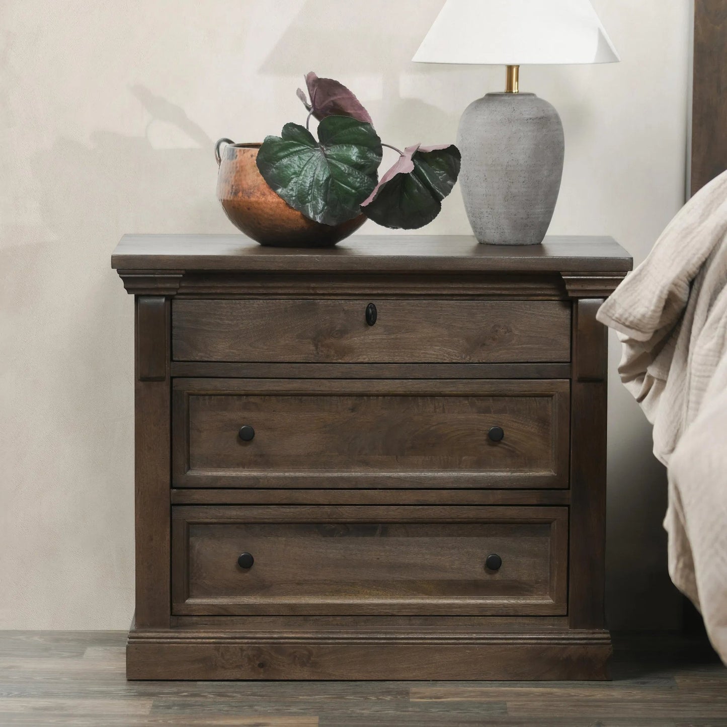 011 SI-2238942 | Lifestyle | Adelaide Three-Drawer Mango Wood Nightstand by Classic Home in cocoa brown. Made from mango wood in a traditional style.