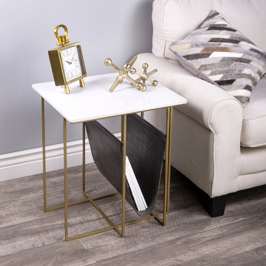 Stephanik Magazine Table by Butler Specialty Company in off white and marble, metal. Made from iron, aged silver finish, leather, aged gray-brown finish, marble in a modern style.