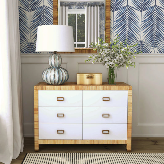 Corfu Dresser by Butler Specialty Company in natural and white and cosmopolitan. Made from wood, plywood, rattan split, aluminum in a modern style.