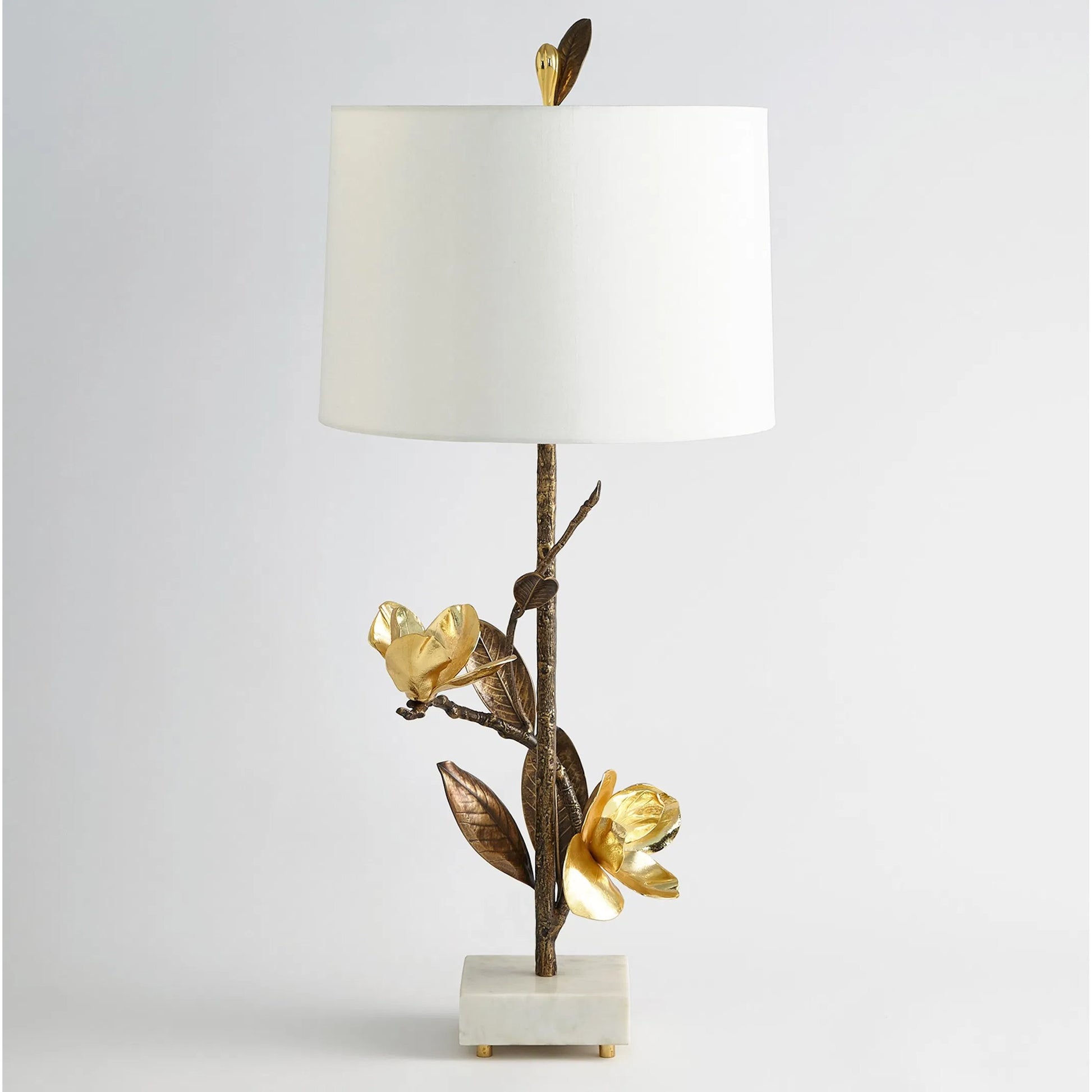 Magnolia Flower Table Lamp by Global Views in antique brass, gold. Made from brass, marble in a modern style.