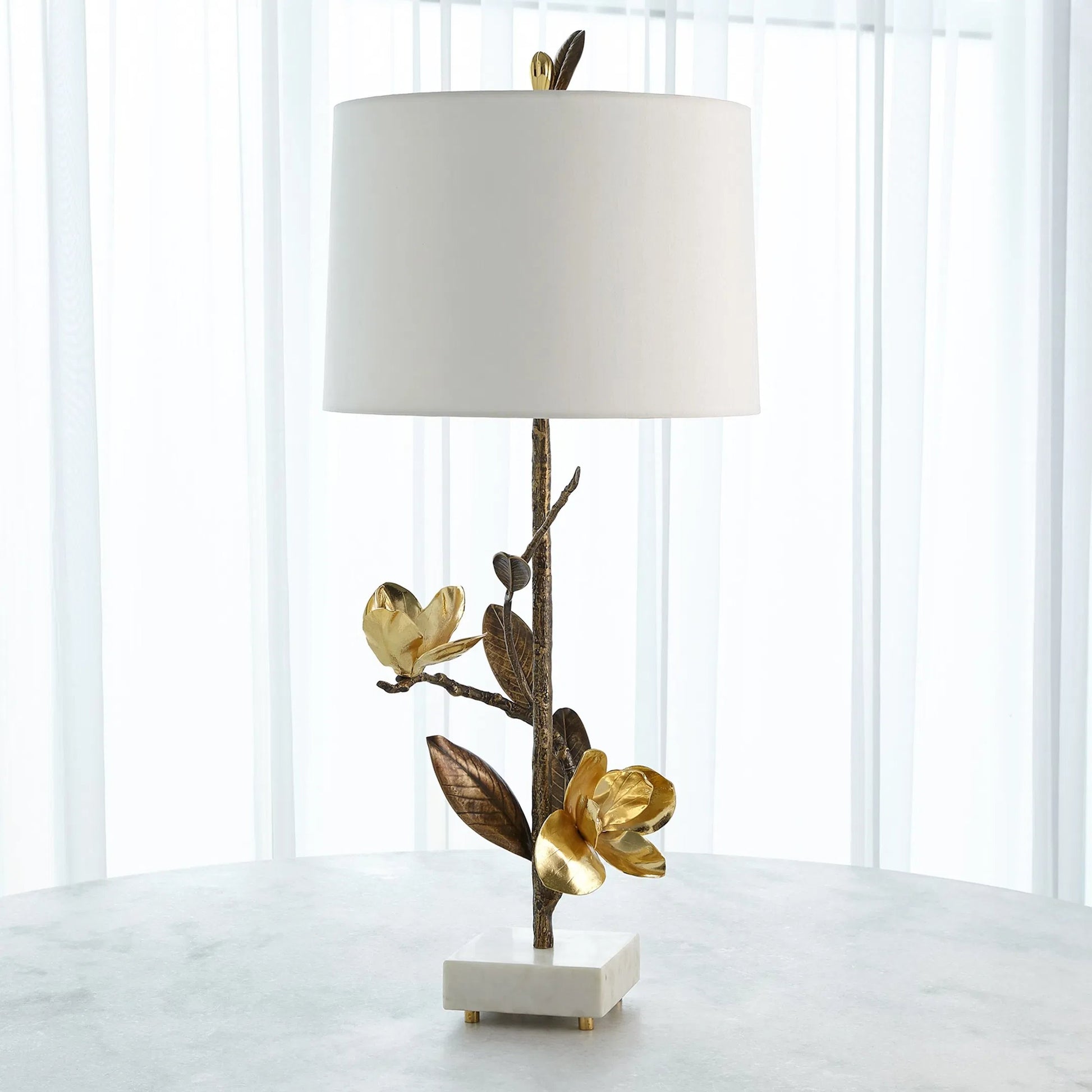 Magnolia Flower Table Lamp by Global Views in antique brass, gold. Made from brass, marble in a modern style.