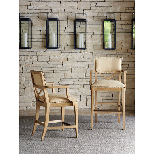 Sutherland Upholstered Bar Stool by Tommy Bahama Home in natural. Made from unique in a coastal style.