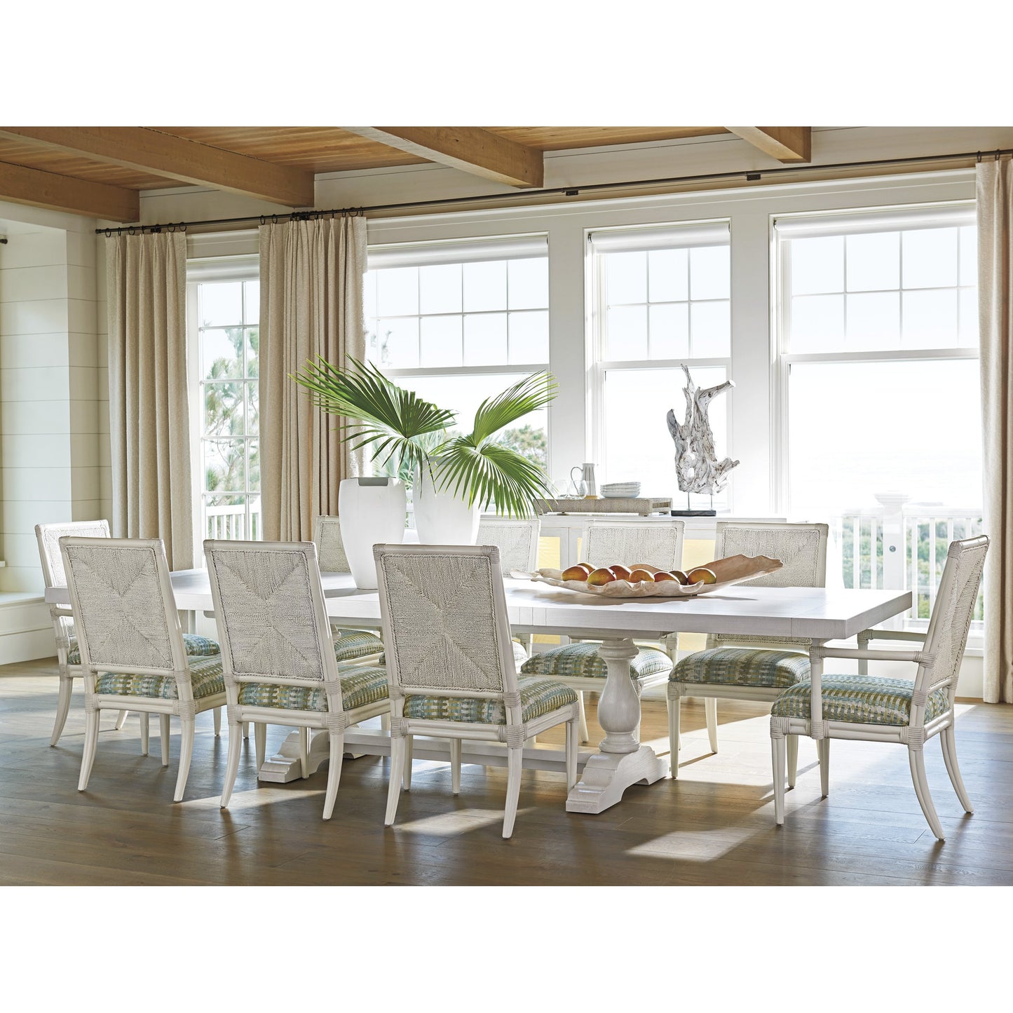 006 SR-836368 | Lifestyle | Regatta Arm Chair by Tommy Bahama Home. Made from textured in a transitional style.