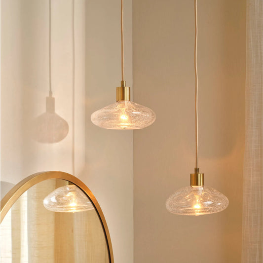 Reservoir Pendant by Jamie Young in antique brass. Made from glass in a unique style.