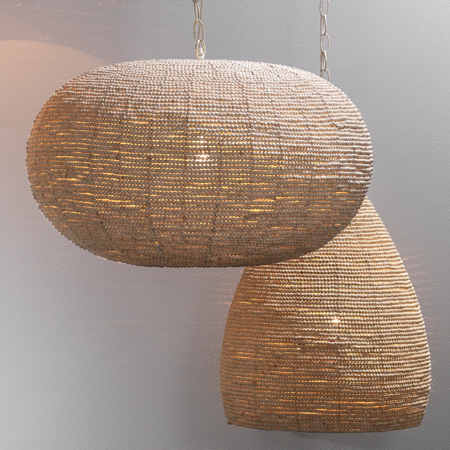 011 SR-867213 | Lifestyle | Whirlpool Pendant by Jamie Young in off white beads. Made from iron, mango wood in a coastal style.