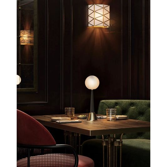 Sortie Cordless Table Lamp by Currey and Company in polished brass, milk. Made from metal, glass in a modern style.