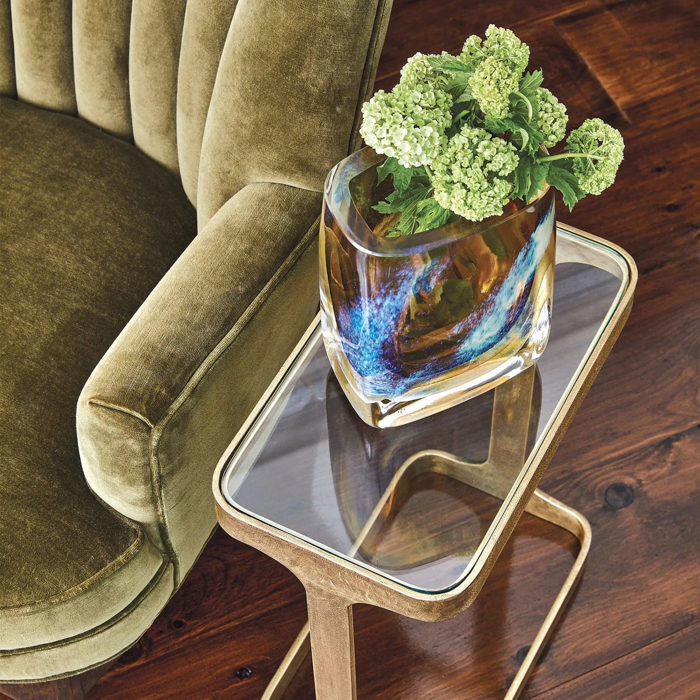 008 SR-702005 | Lifestyle | Saddle Table by Global Views. Made from iron, glass in a modern style.