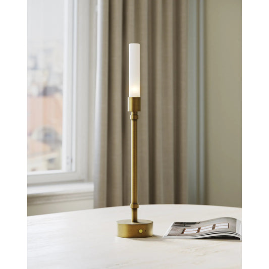 Paseo Cordless Table Lamp by Currey and Company in polished antique brass, clear. Made from metal, glass in a modern style.
