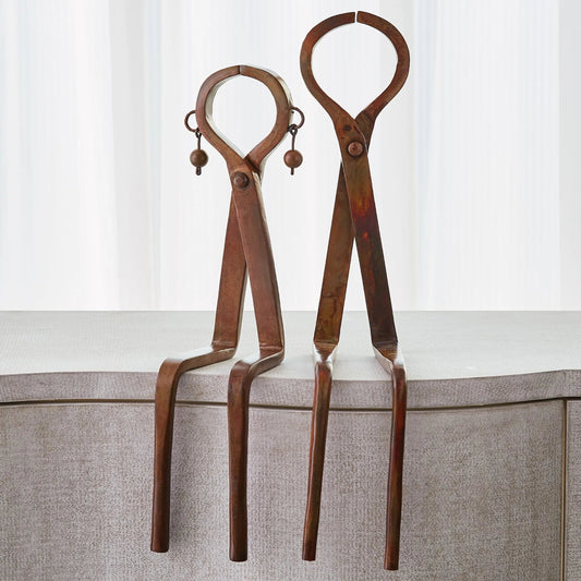 Iron Sitting Couple by Global Views. Made from iron in a modern style.