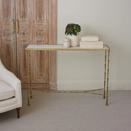 Spike Console by Global Views in antique brass. Made from iron, white marble in a transitional style.