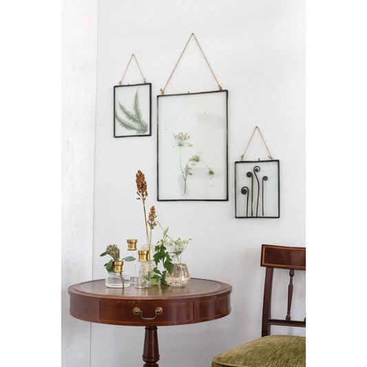 Hanging Metal Frame by Accent Decor in silver. Made from metal in a modern style.