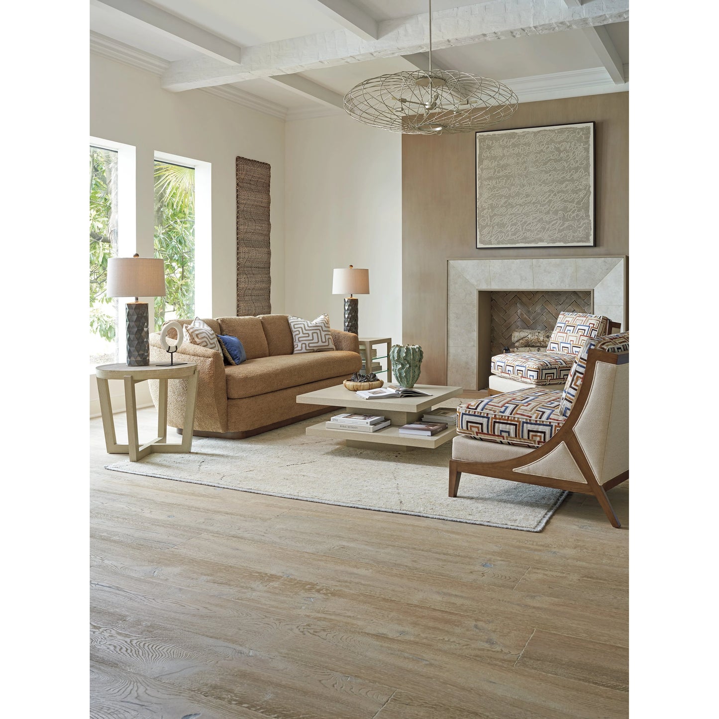 005 SI-2136904 | Lifestyle | Shasta Round Lamp Table by Tommy Bahama Home in sand drift. Made from unique in a modern style.