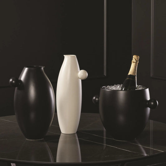 Ball Handled Pitcher by Global Views in white. Made from ceramic in a modern style.