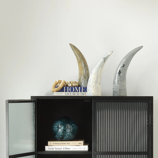 Varigated Horn Decorative Objects by Jamie Young in swirled cream, black, grey. Made from resin in a rustic style.