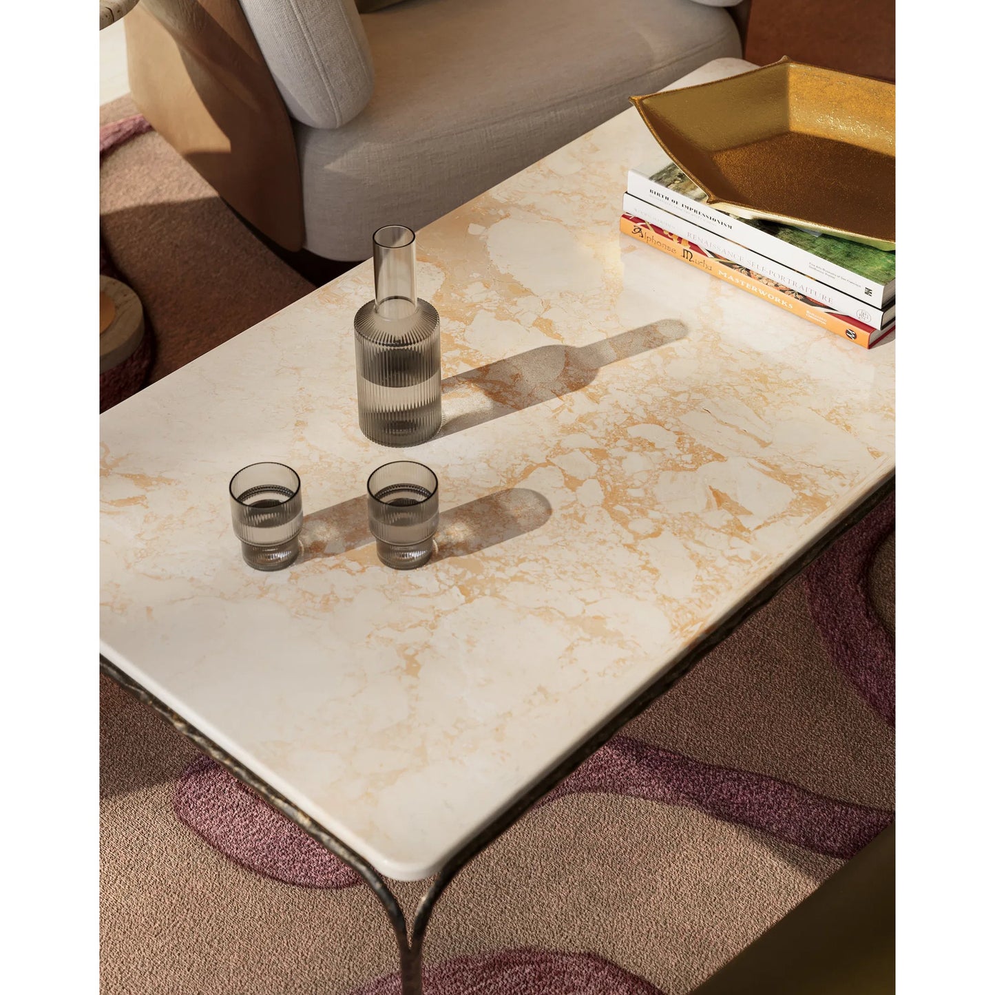 006 SI-2387004 | Lifestyle | Crema Cocktail Table by Currey and Company in natural, bronze. Made from marble, iron in a modern style.