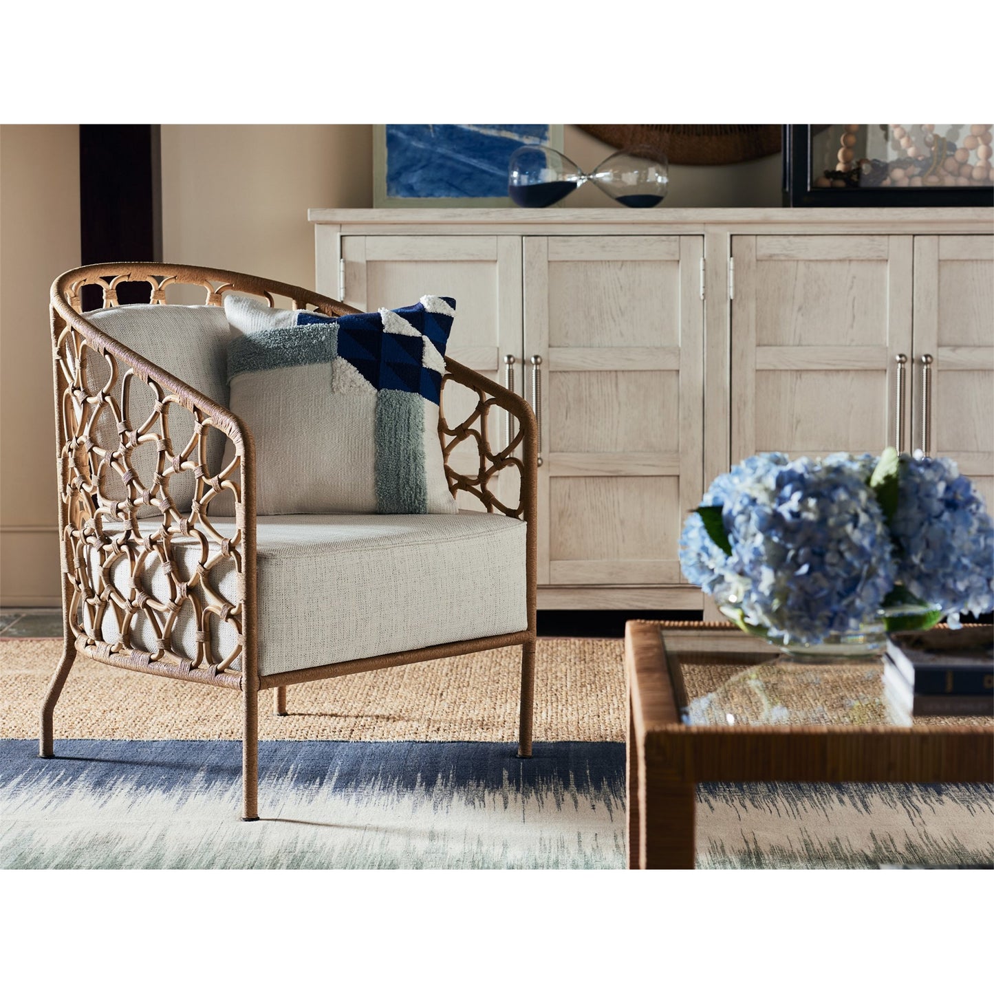 005 SR-813122 | Lifestyle | Coastal Living Pebble Accent Chair by Coastal Living by Universal Furniture in na and rattan, dover natural. Made from 96% polyester, 2% nylon, 2% cotton in a coastal style.