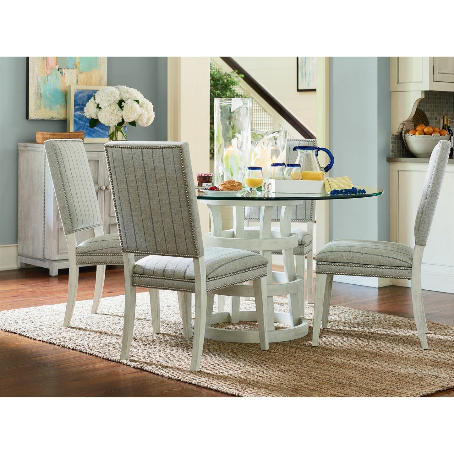 008 SR-813129 | Lifestyle | Coastal Living Round Glass Table 54" by Coastal Living by Universal Furniture in na and sandbar. Made from unique in a coastal style.