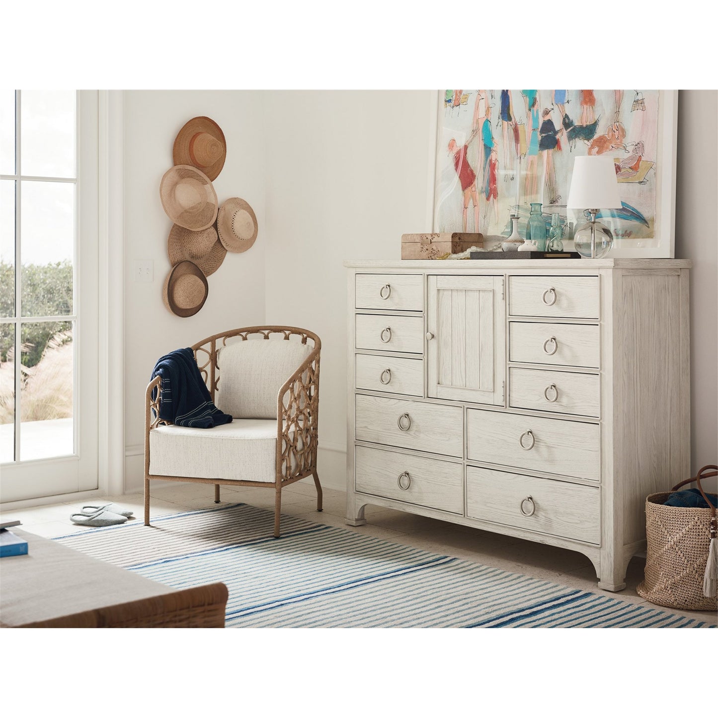 004 SR-813122 | Lifestyle | Coastal Living Pebble Accent Chair by Coastal Living by Universal Furniture in na and rattan, dover natural. Made from 96% polyester, 2% nylon, 2% cotton in a coastal style.