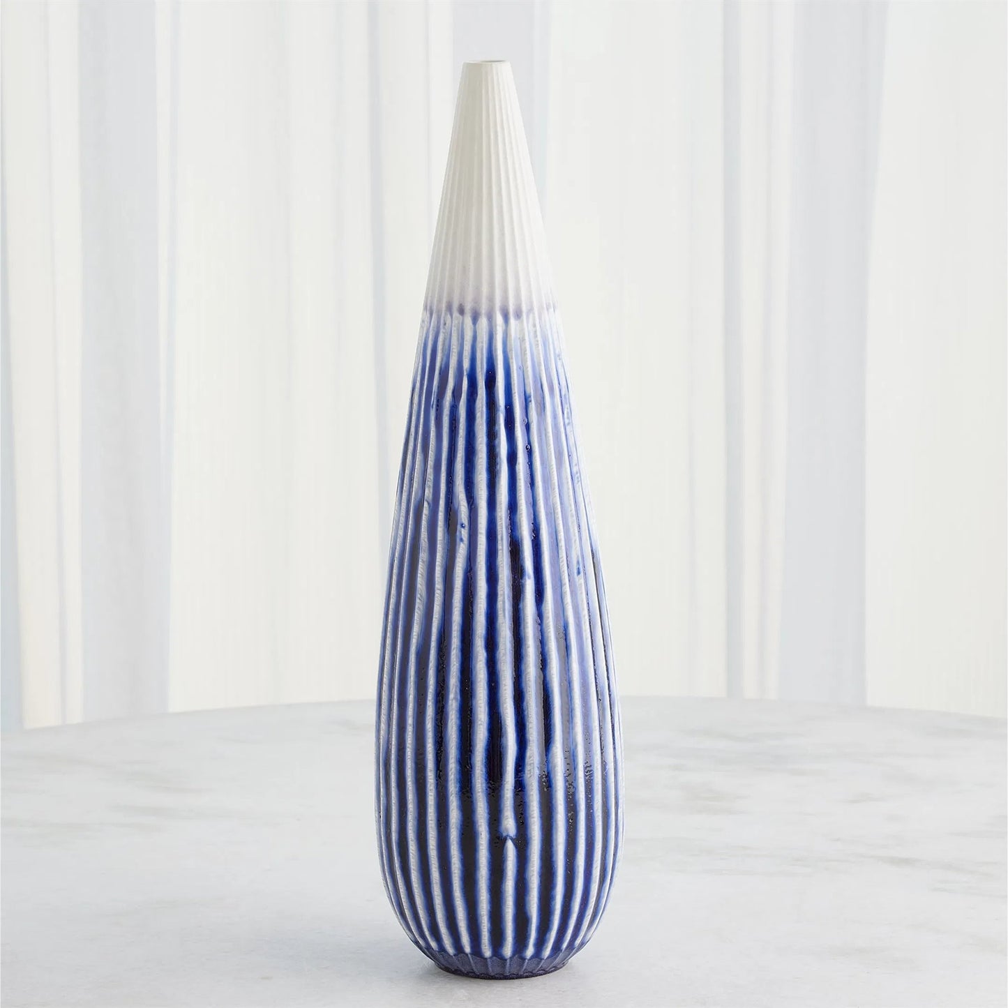 012 SI-2445439 | Lifestyle | Furrow Taper Vase by Global Views. Made from ceramic in a modern style.