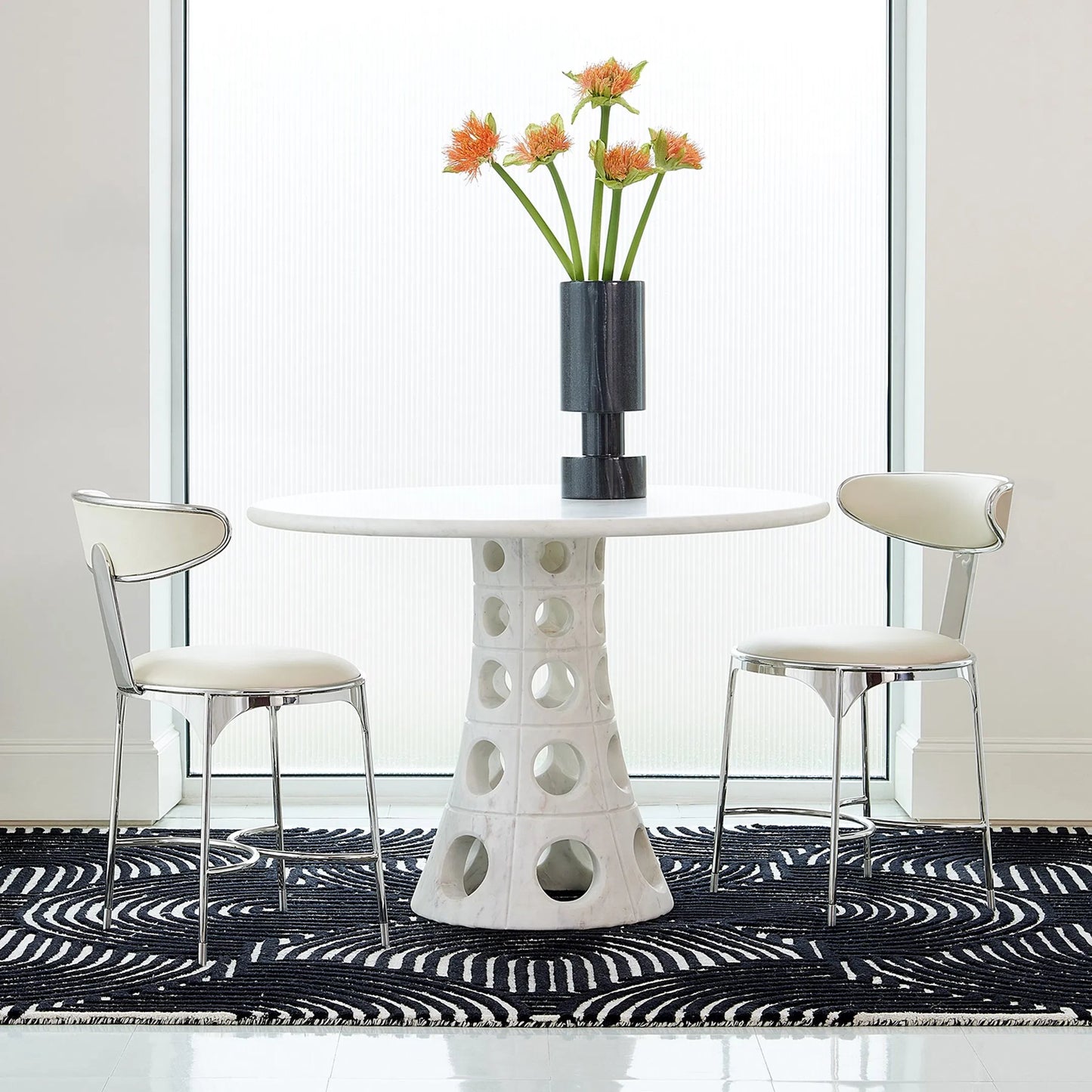 009 SR-702158 | Lifestyle | Taper Circle Dining Table by Global Views. Made from white honed marble in a eclectic & global style.