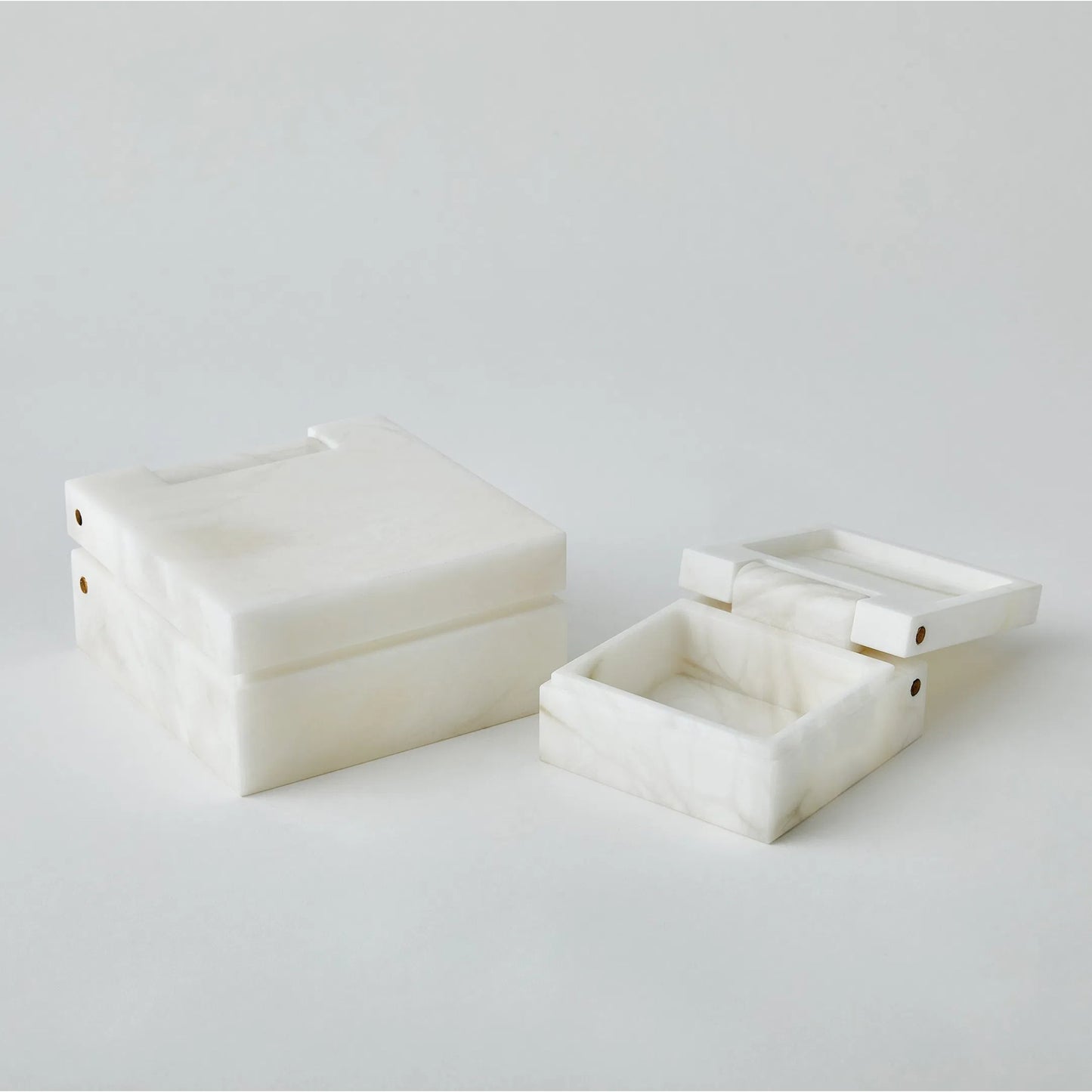 005 SI-2445583,SI-2445584 | Lifestyle | Hinged Alabaster Box by Global Views in white. Made from alabaster in a modern style.