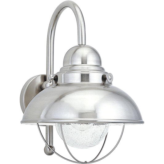 Sebring Large One-Light Outdoor Wall Lantern by Visual Comfort & Co.. Made from aluminum, clear seeded glass in a cottage & farmhouse style.