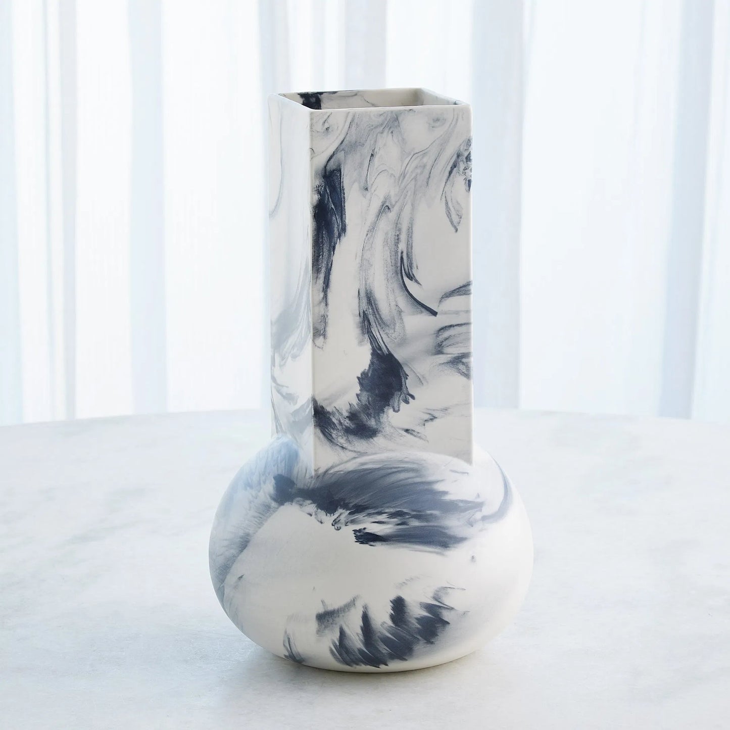 011 SI-2445708 | Lifestyle | Crocus Vase by Global Views. Made from earthenware in a modern style.