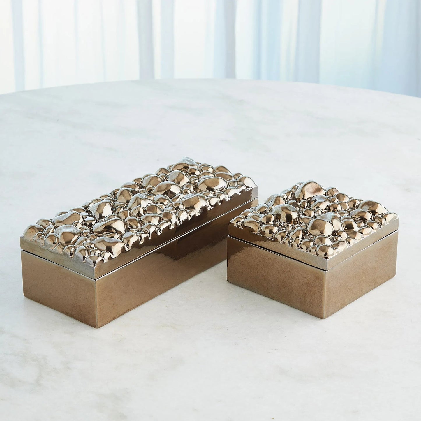 002 SI-2445482 | Lifestyle | Pebbles Rectangular Box by Global Views in bronze. Made from ceramic in a modern style.