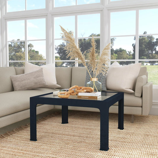 Chatham Raffia Coffee Table by Butler Specialty Company in navy blue. Made from saguran raffia, glass, gmelina arborea wood in a modern style.