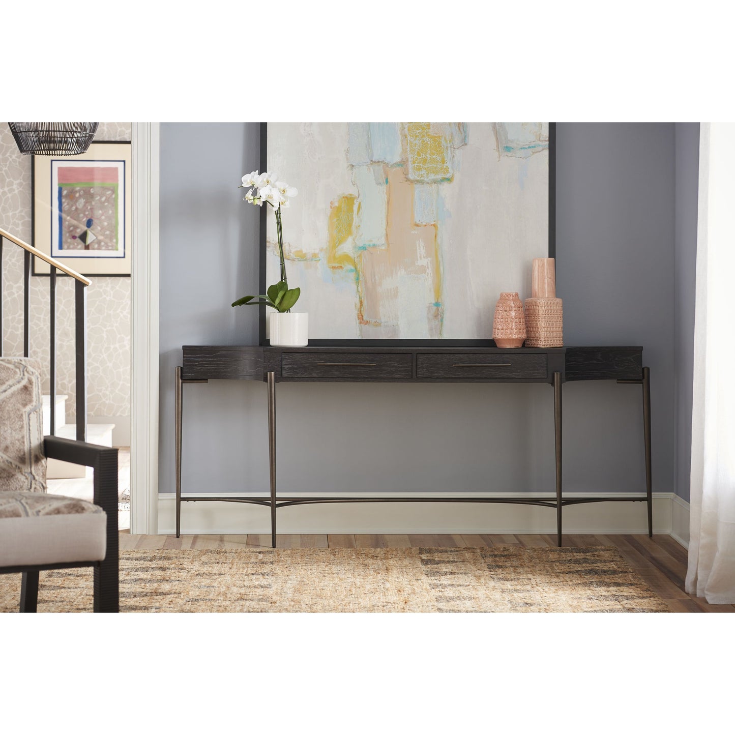 002 SR-813265 | Lifestyle | Curated Oslo Console Table by Universal Furniture in oil rubbed bronze and oak. Made from unique in a transitional style.