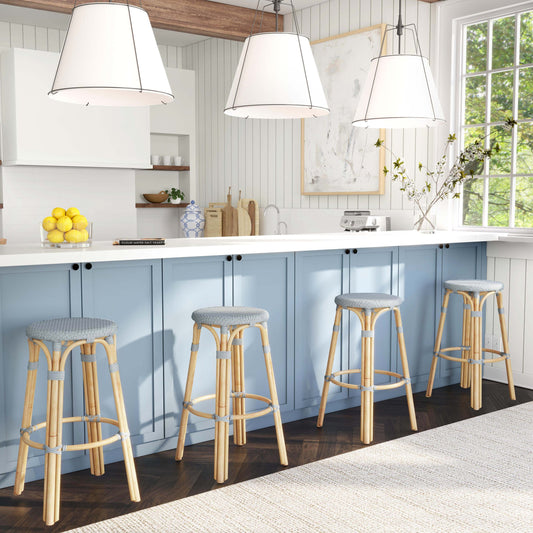 Tobias Wood Bar Stool by Butler Specialty Company. Made from rattan, polyurethane synthetic rattan in a coastal style.