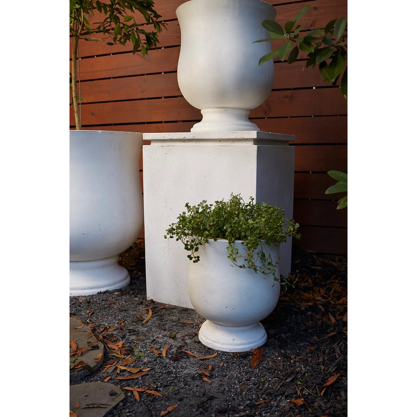 002 SI-2255046 | Lifestyle | Hilltop Urn by Accent Decor in white. Made from concrete in a rustic style.