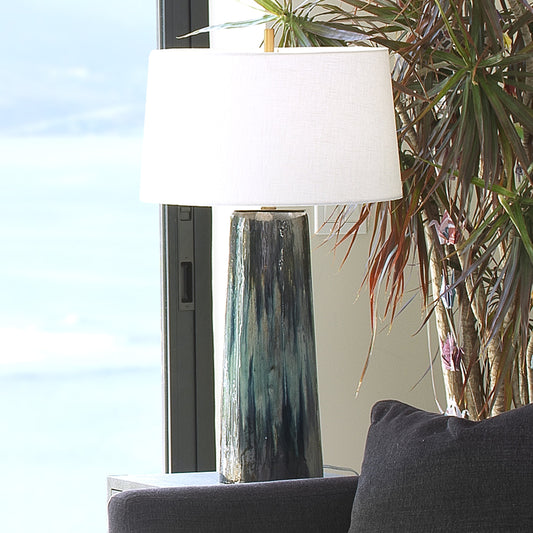Brushstroke Table Lamp by Jamie Young in aqua, dark blue, metallic ombre reactive glaze. Made from ceramic in a transitional style.