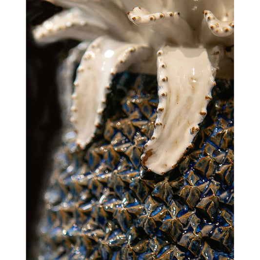 Waikiki Pineapple by Currey and Company in blue, white. Made from ceramic in a coastal style.