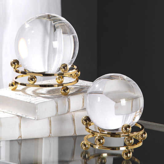 Alega Spheres by Uttermost in polished gold. Made from crystal, steel in a transitional style.