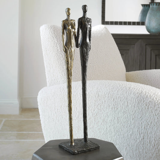 Two's Company Sculpture by Uttermost in antique brass, dark bronze. Made from cast iron in a modern style.