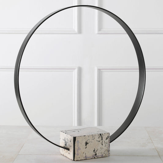 Around Again Circular Sculpture by Uttermost in satin black. Made from stone, metal in a modern style.