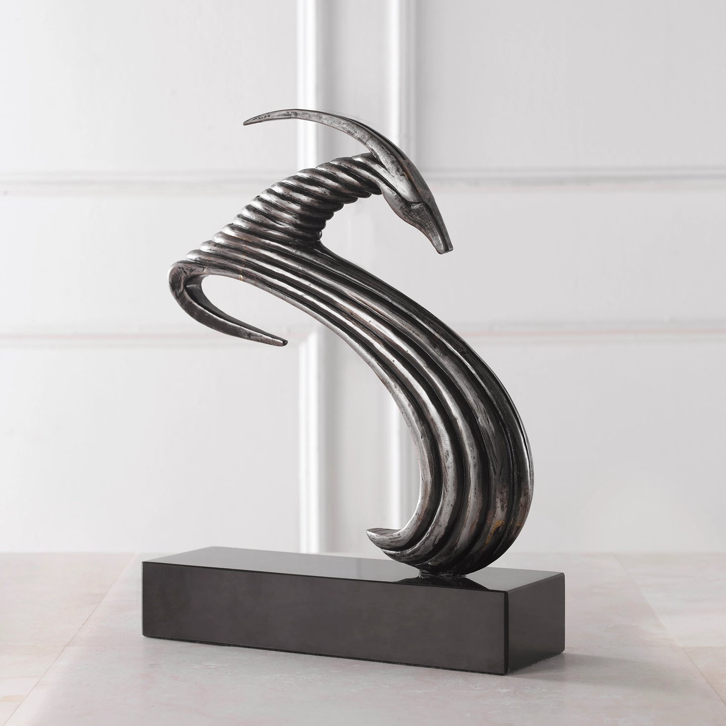 006 SI-1981245 | Lifestyle | Take the Lead Sculpture by Uttermost in aged silver. Made from iron, marble in a modern style.